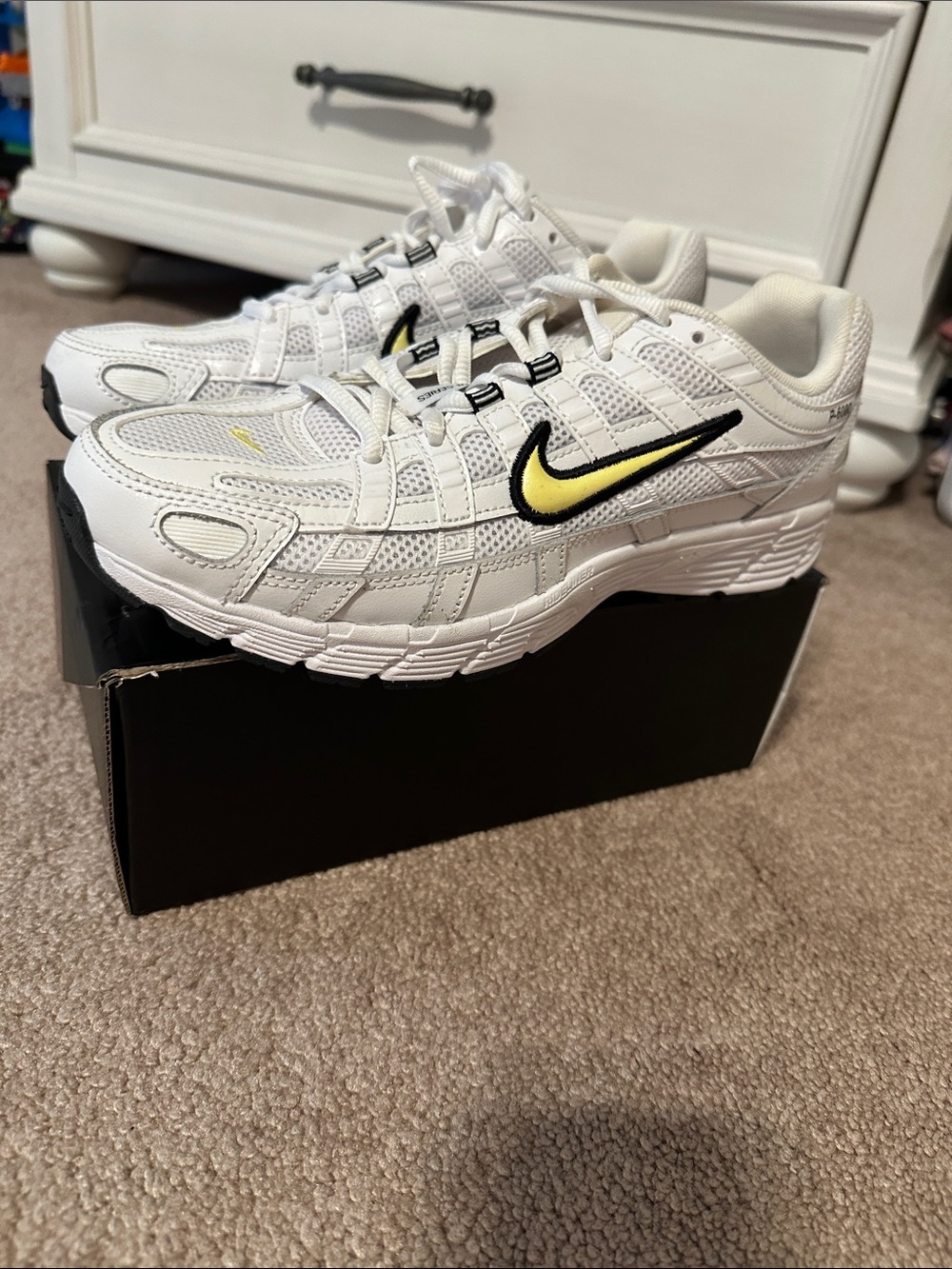 Nike White Sneakers with Yellow and Black Swoosh